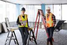 Construction Workers On Site Of Office Renovation