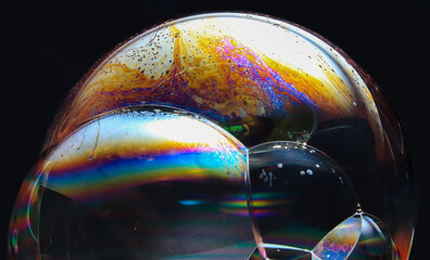 Poster - Colorful soap bubbles on a black background