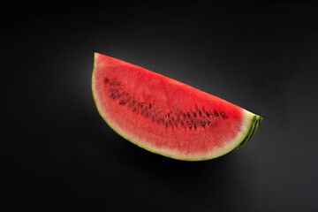 slices of watermelon isolated on black background