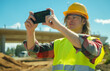© M-Production - Building contractor with mobile phone shooting work they done.