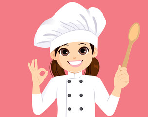 Happy little girl chef making ok hand gesture smiling