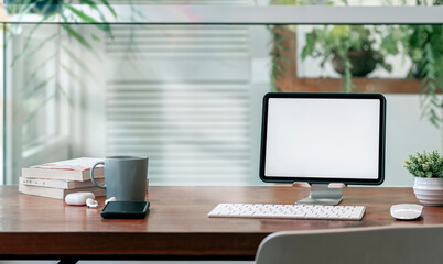 Wall Mural - Comfortable workspace in modern room with tablet on stand.