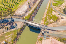 Aerial View Of A Road Crossing Over Flood Gates On A Water Channel
