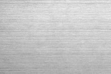 Shiny Silver Polished Metal Background Texture Of Brushed Stainless Steel Plate With The Reflection Of Light.