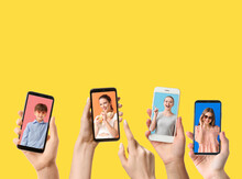 Group Of People With Mobile Phones Taking Photo On Color Background