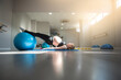 pregnant woman exercising alone in a pilates class in a clinic. pilates concept. prepartum