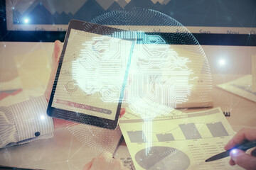Fototapete - Double exposure of man's hand holding and using a digital device and brain hologram drawing. Data concept.