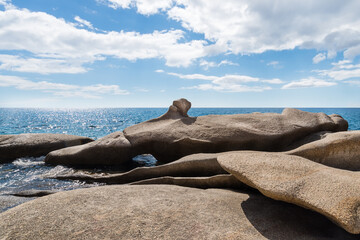 Wall Mural - Granite rocks shaped by the sea of the south coast of the Greek island of Ikaria in the North Aegean