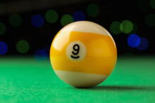 Billiard Ball With Number 9 On Green Table, Closeup