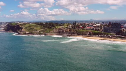 Sticker - Newcastle beach and Nobbys head in aerial panorama of Pacific coast as 4k.
