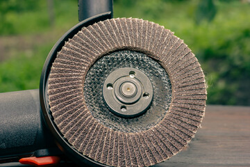 Abrasive wheel for a grinder. Angle grinder. Hand tool for grinding. Electric tool.