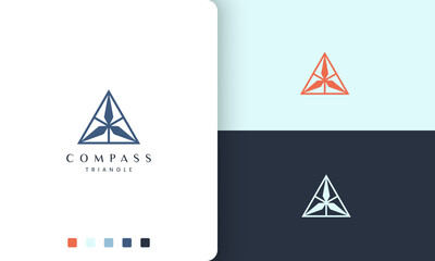 Wall Mural - navigation or adventure logo with a simple and modern triangle compass shape