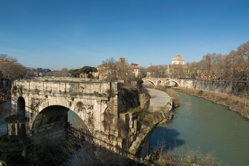 partially destroyed 2,200-year-old Pons Aemilius, also called Ponte Rotto (Broken Bridge) on Tiber river, as seen from  Ponte Palatino, Rome, Italy