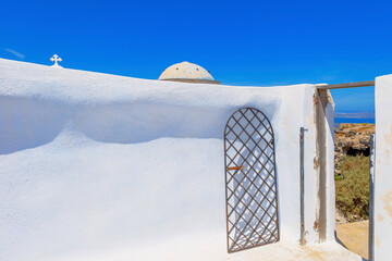 Wall Mural - Greece Santorini island in Cyclades, traditional view of white washed houses with colorful wooden frames