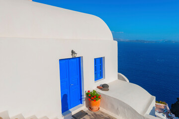 Wall Mural - Greece Santorini island in Cyclades, traditional white washed view of houses in main capitol above the sea of caldera at summer