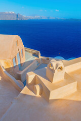 Wall Mural - Stunning cupolas with the Caldera (volcano) in the distance in the Greek island of Santorini