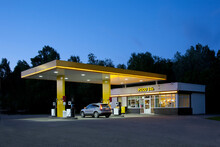 Gas station, petrol station on a road at dusk. 
