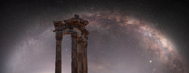 Wall Mural - Columns of the ancient city of Pergamon, Milky way galaxy in the background - Bergama, Turkey