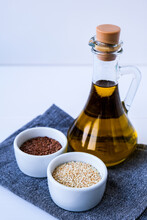Sesame And Flax Seeds With Oil In Glass Bottle. Healthy Food Concept. Vegan Keto Diet. Healthy