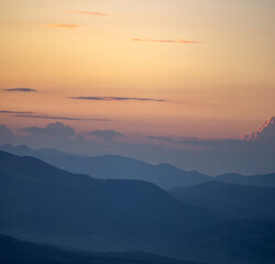 Wall Mural - panorama, smoky silhouette of the carpathian mountains at sunset