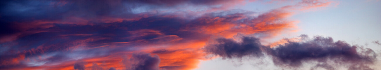 Wall Mural - beautiful colorful orange clouds at sunset, beautiful summer landscape in the evening in the carpath