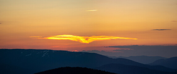 Wall Mural - beautiful colorful orange clouds at sunset, beautiful summer landscape in the evening in the carpath
