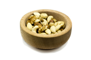 Wall Mural - Mixed nuts in wooden bowl isolated on white background