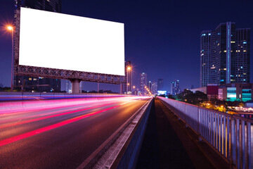 blank billboard on light trails, street and urban in the night - can advertisement for display or montage product or business