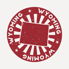 Wall Mural - Wyoming stamp. Travel red rubber stamp with the map of us state, vector illustration. Can be used as insignia, logotype, label, sticker or badge of the Wyoming.