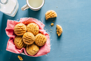 Wall Mural - cookies in a bowl on a blue background. homemade baking. copy space