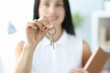 © H_Ko - Smiling woman holds in hand keys to housing