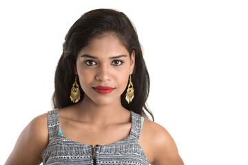 Portrait of beautiful young smiling girl posing on white background