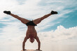 © ZaStock - Young man is doing street workout. Handstand exercise, bodyweight