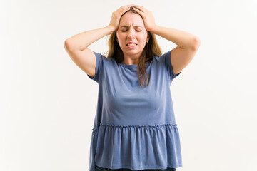 Wall Mural - Sick woman suffering from a strong headache