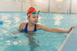 © Olleg1 - Girl learning to swim. Sports and entertainment for children. Swimming competition. Healthy lifestyle from childhood.