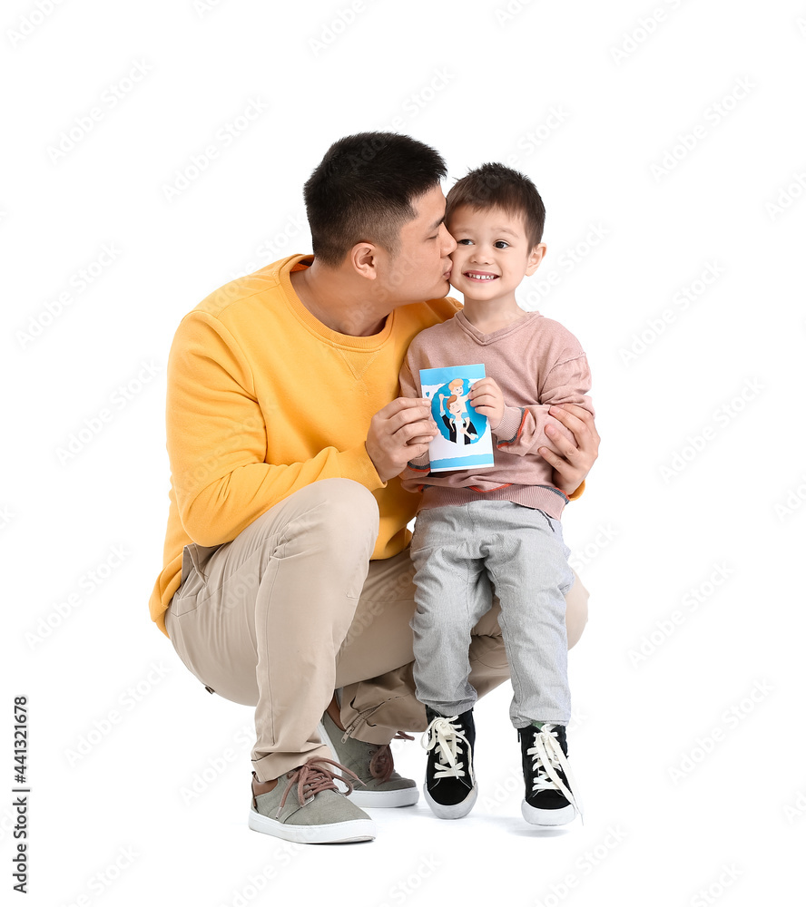 Little boy greeting his dad on Father's Day against white background