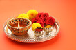 Diwali glowing Diya and flowers arranged for Diwali Celebration