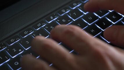 Top view of hand typing on laptop or computer.
