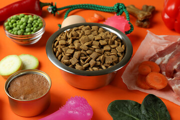 Concept of organic pet food on orange background