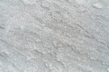 Pattern Of Seamless Rock Texture And Surface Background Close Up. Rough Split Face Stone Texture.