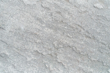 Pattern of Seamless rock texture and surface background close up. Rough split face stone texture.