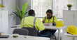 © TommyStockProject - African warehouse workers eating meal in industrial canteen