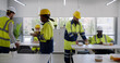 © TommyStockProject - Construction company workers having takeaway lunch in modern office