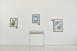 © Seventyfour - Minimal background image of modern art gallery with abstract paintings on white wall, copy space