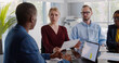 © TommyStockProject - Female team leader talk with multiethnic colleagues at briefing