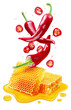 Fresh red chilli pepper and sections of chilli pepper floating over honeycombs and honey puddle isolated on white background. Clipping path.