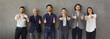 © Studio Romantic - Banner with group portrait of happy successful young and senior business people in smart office suits doing thumbs up gesture standing together near grey wall. Dream team and job satisfaction concept