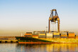 © Austockphoto - The bow of a ship being loaded with containers at the Port of Brisbane