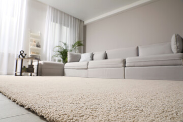 Poster - Living room interior with stylish furniture, focus on soft carpet