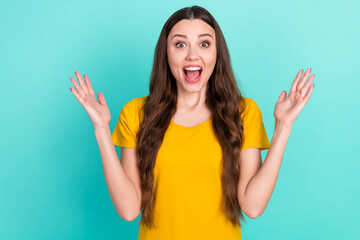 Poster - Photo of cool millennial lady hands up yell wear yellow t-shirt isolated on vivid teal color background